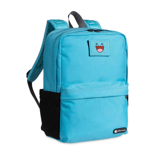 Light blue backpack with a cartoon face patch on a white background